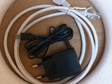 a white cord and a charger on a table
