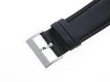 a close up of a black leather watch strap on a white background