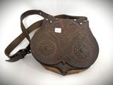 a brown purse with a brown strap on a white background