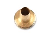 a small gold vase sitting on a white surface
