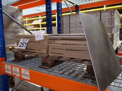 a large stack of boxes sitting on a shelf in a warehouse