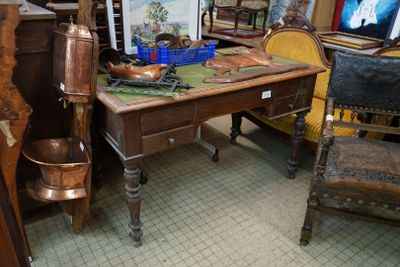 a desk with a chair and a picture on it