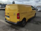 a yellow van that is parked on the side of the road