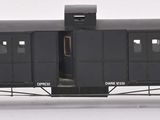 a black train car that is sitting on a white surface