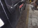 an image of a car being worked on in a garage