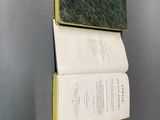 an open book on the wall with a bookmark on top of it