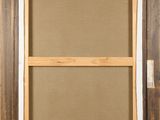 a close up of a picture frame on a wall with a brown background