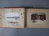 an old photo of a book opened to show a picture of a bridge