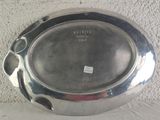 a silver plate that is sitting on a table