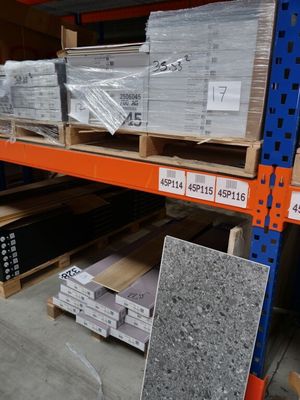 many boxes of granite on the shelves in the store