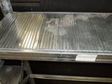 an image of a metal work bench in a kitchen