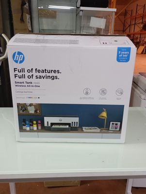 a white box on a table with a printer on it