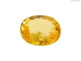 une pierre de saphir jaune sur fond blanc