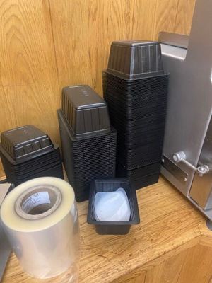 many different types of plastic containers on a shelf