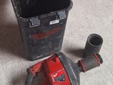 an image of a drill and a bucket on the floor