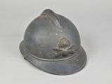 a helmet with a bird on it on a white surface