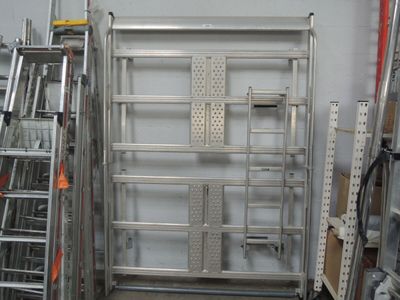 a metal rack with ladders and a ladder on it