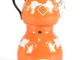an orange teapot with a black handle and a white top