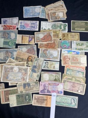 many different types of money on a black table