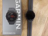 the garmin watch is sitting on top of a wooden table
