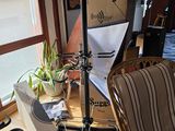 a room with a chair, a chair, and a light in it