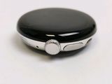 a close up of a smart watch on a white surface
