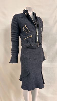 an image of a mannequin dress with a jacket and skirt
