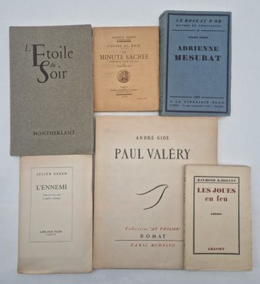 several books are stacked on top of each other on a table