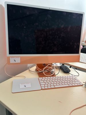 a computer on a desk with a keyboard and mouse