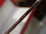 a close up of a pair of scissors on a table