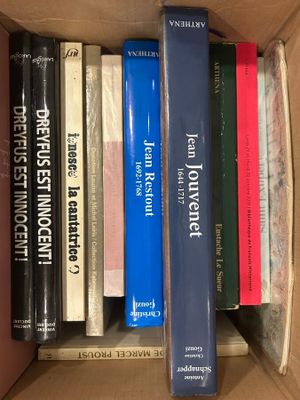 a box full of books that are sitting on top of each other