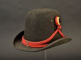 a black hat with a red ribbon around the brim