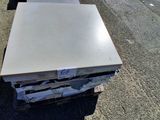 a stack of boxes sitting on the side of the road