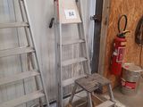 two ladders next to each other in a garage