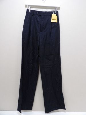 a close up of a pair of black pants hanging on a wall