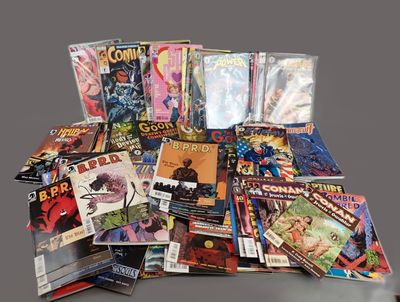 a lot of comic books that are on the table