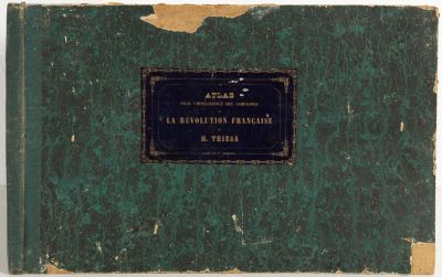 an old green book with a black label on it