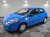 a blue car is parked in a room with a checkered floor