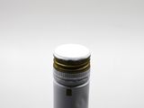 a bottle of wine sitting on a table with a white background