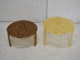 two stools made out of rice sitting next to each other
