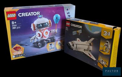 Deux boîtes de jouets Lego Creator sont représentées sur un fond noir.