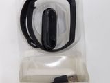 a smart bracelet in the packaging on the table