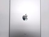 an apple ipad sitting on top of a white table next to a white wall