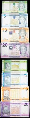 a lot of different bills on a black background