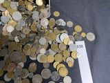 a pile of coins sitting on a table with a price tag