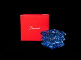 blue glass angel figurine in a red box on a black background