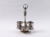 a silver plate with a candle holder on top of it