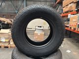 two tires stacked on top of each other in a warehouse