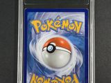 a close up of a nintendo game card with a pokemon ball on it