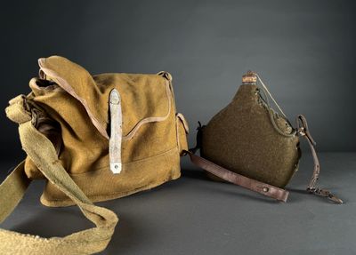 pair of brown canvas bags with leather handles on grey surface
